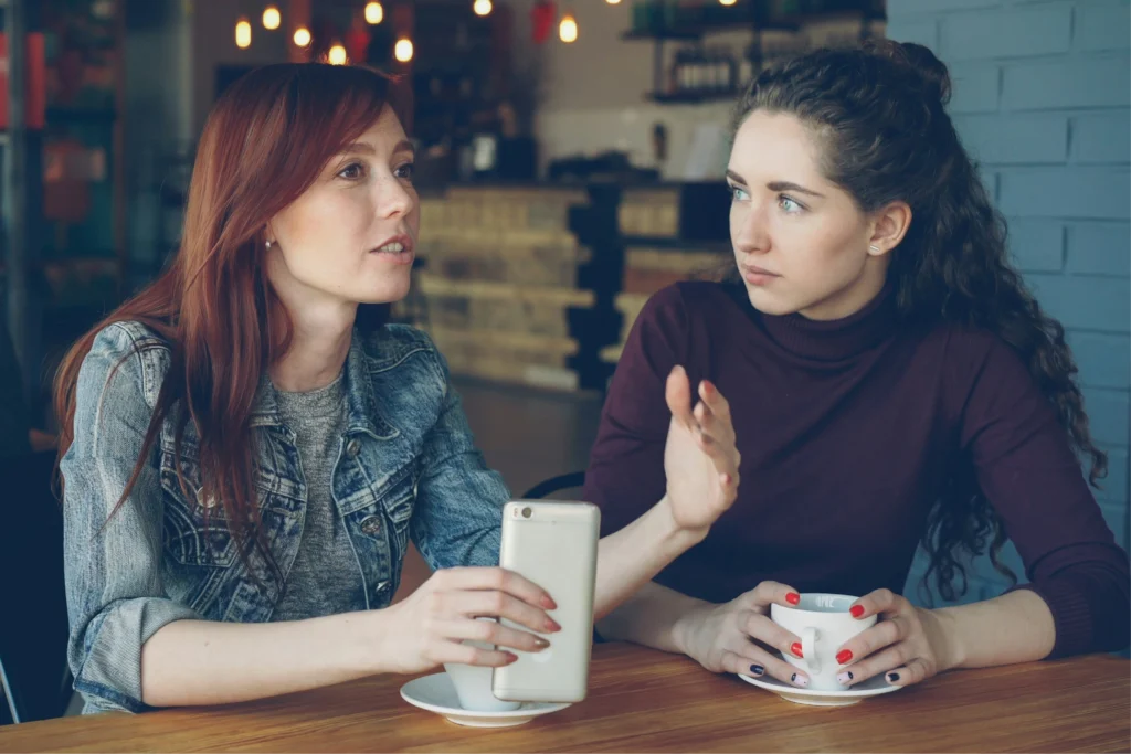 Two colleagues having a private one-on-one conversation